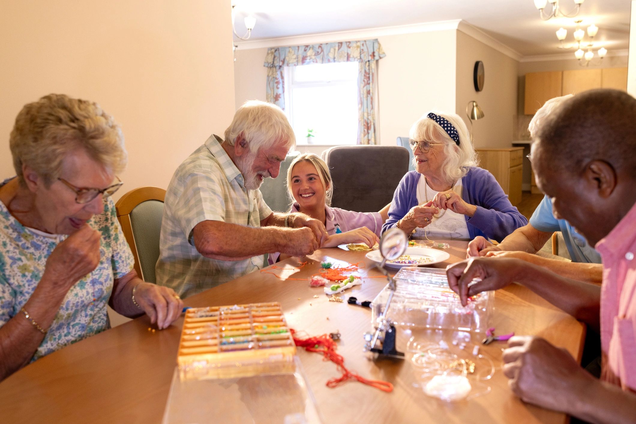 Group gathered around a table in a warm learning setting