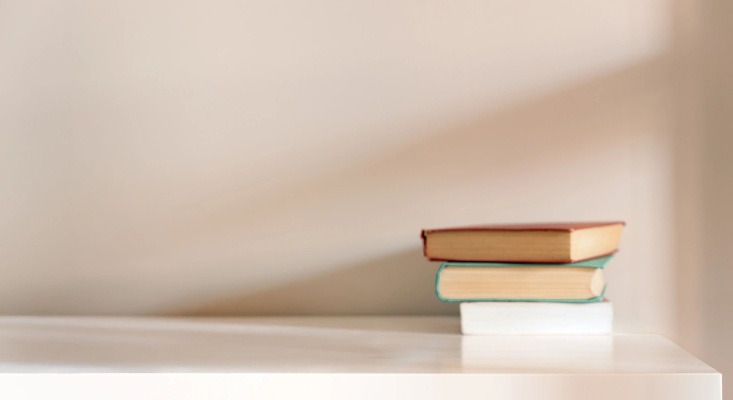 Books arranged on a desk for reflective study